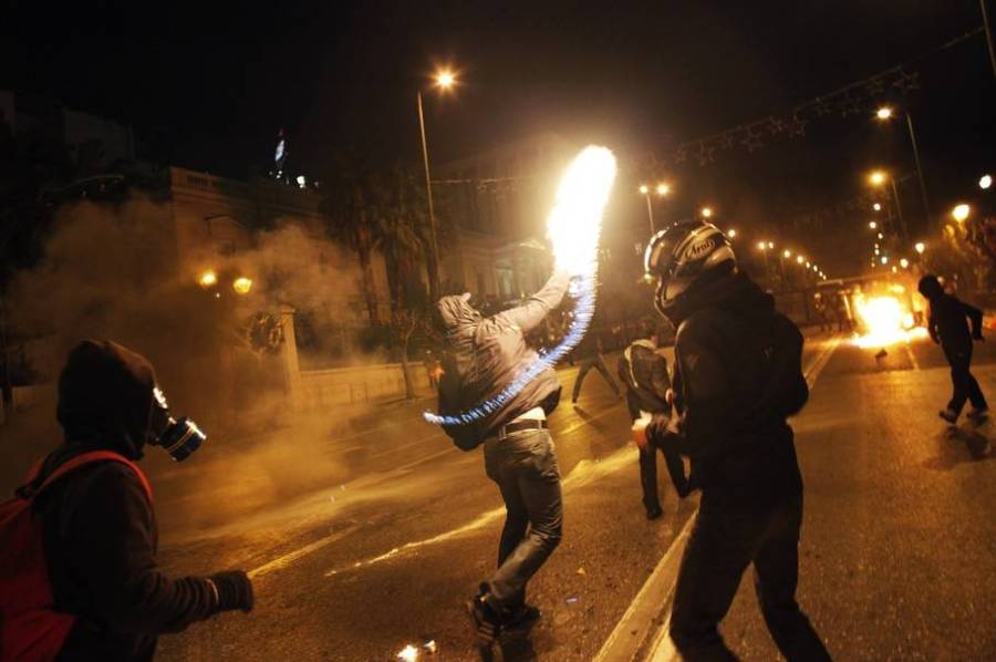 A protestor throws a molotov cocktail  a